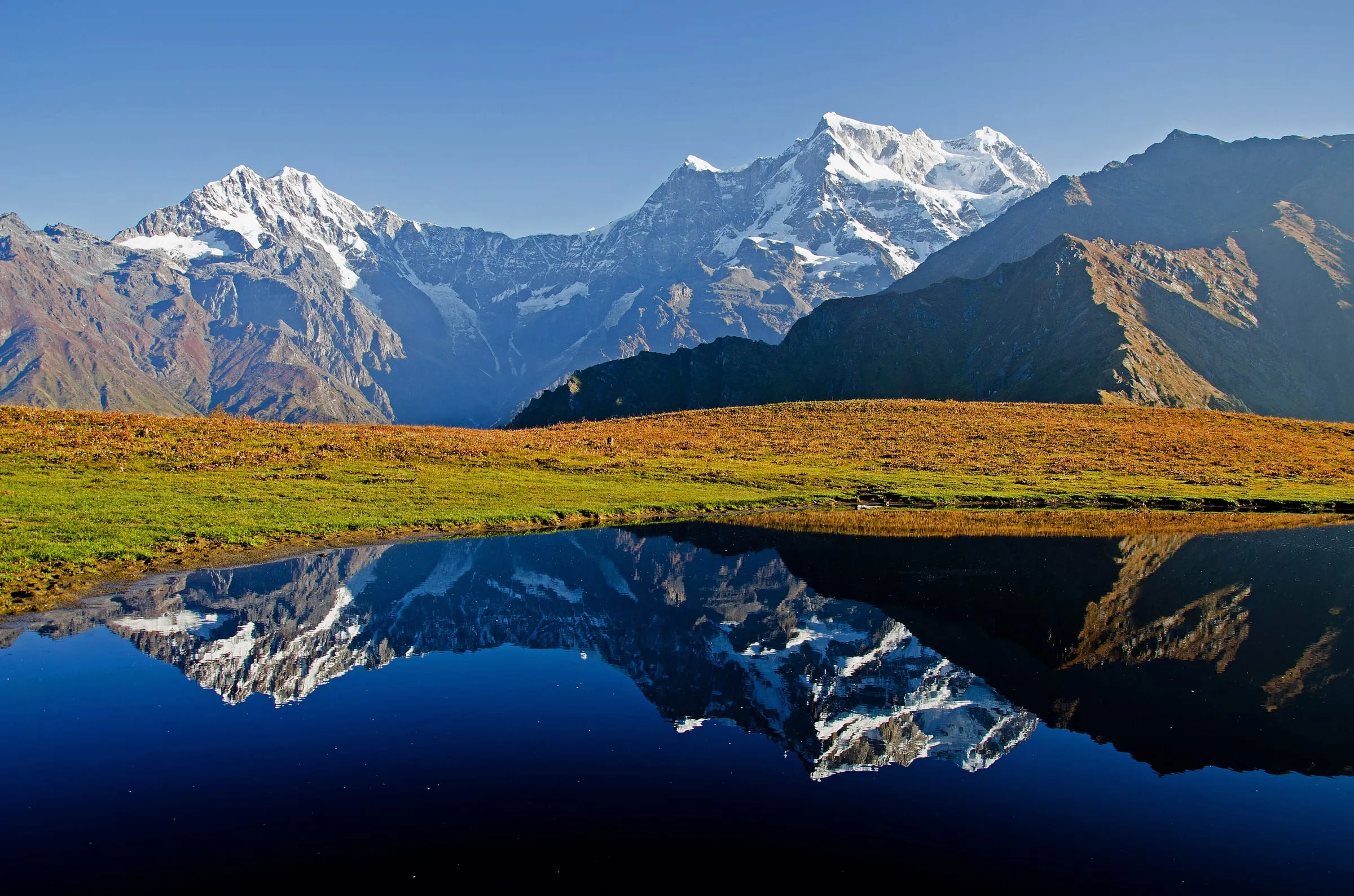 Chaukhamba peak reflected in the small lake at Budha Madhyamaheshwar