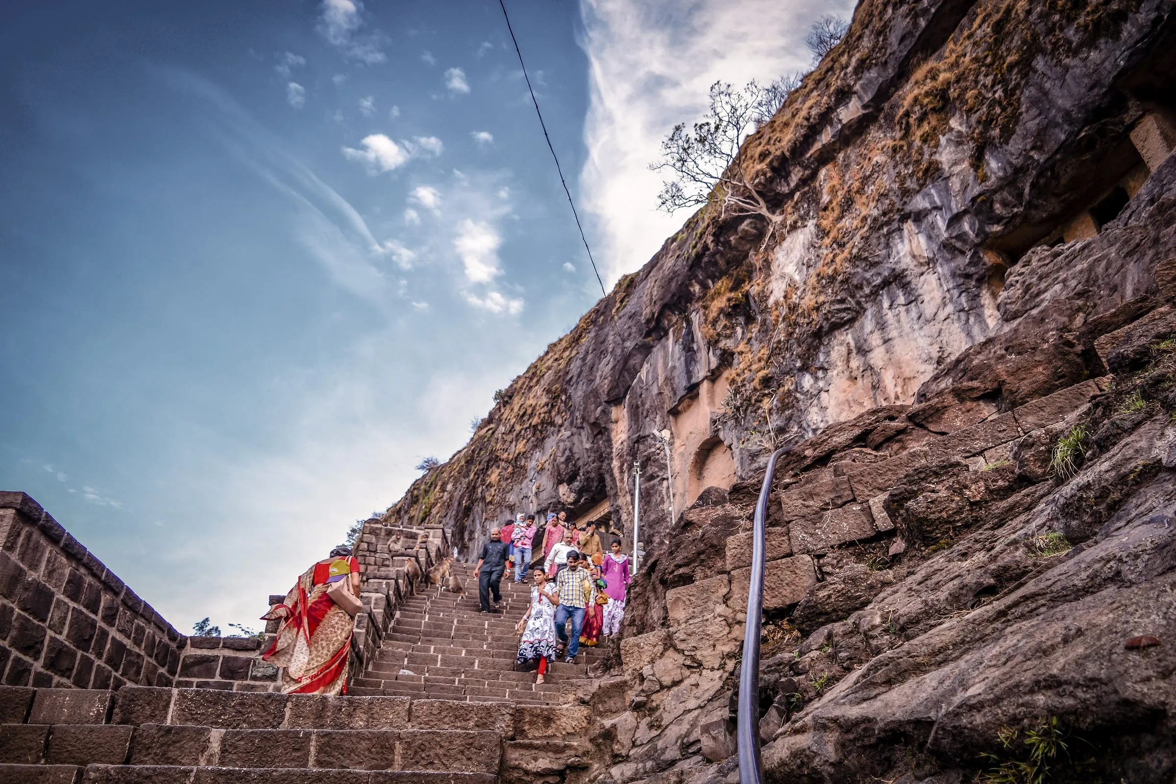 The cliff face of the Lenyadri caves seen from below