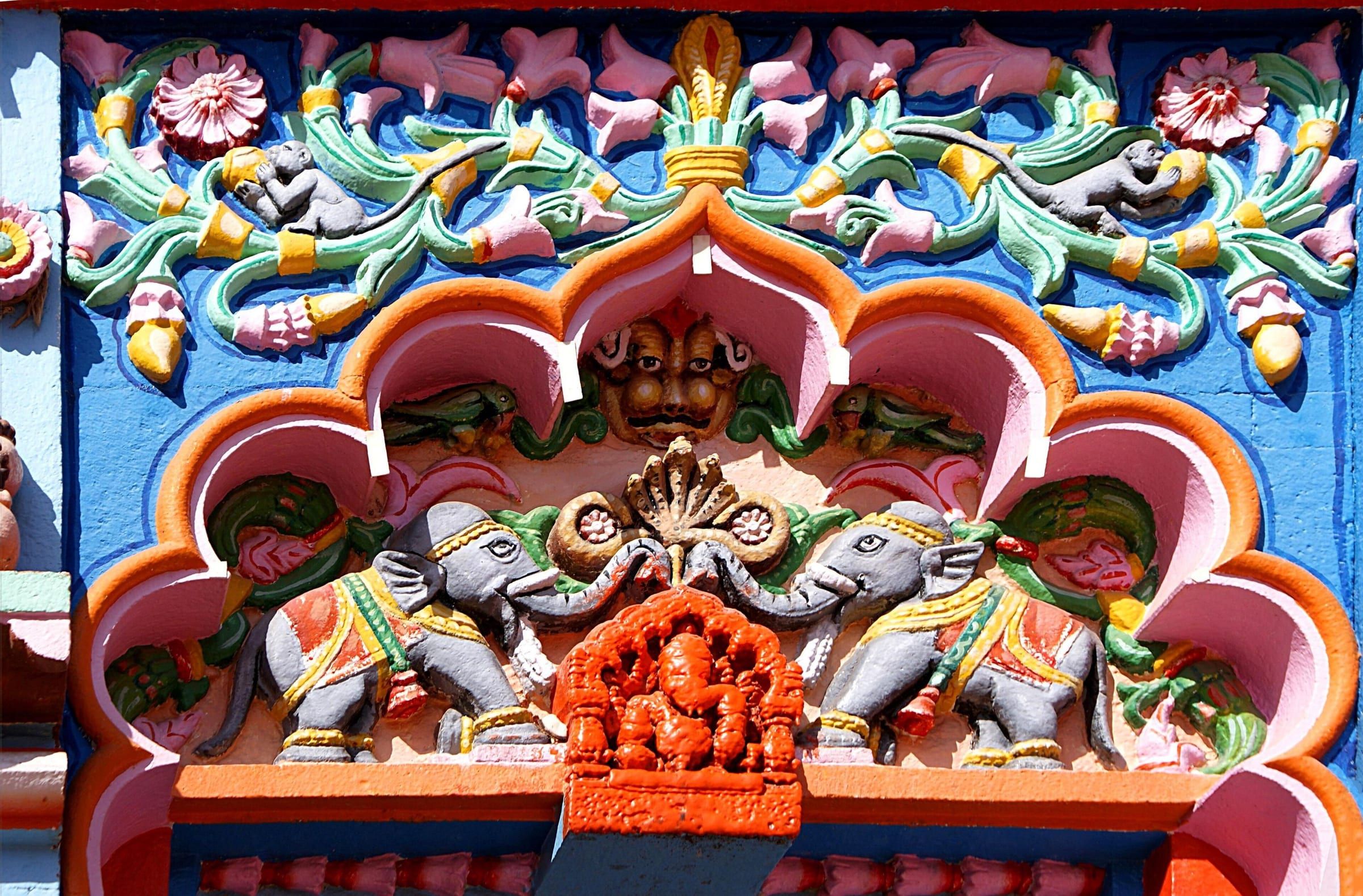 The brightly painted, carved gateway of the Vighneshwar temple at Ozar