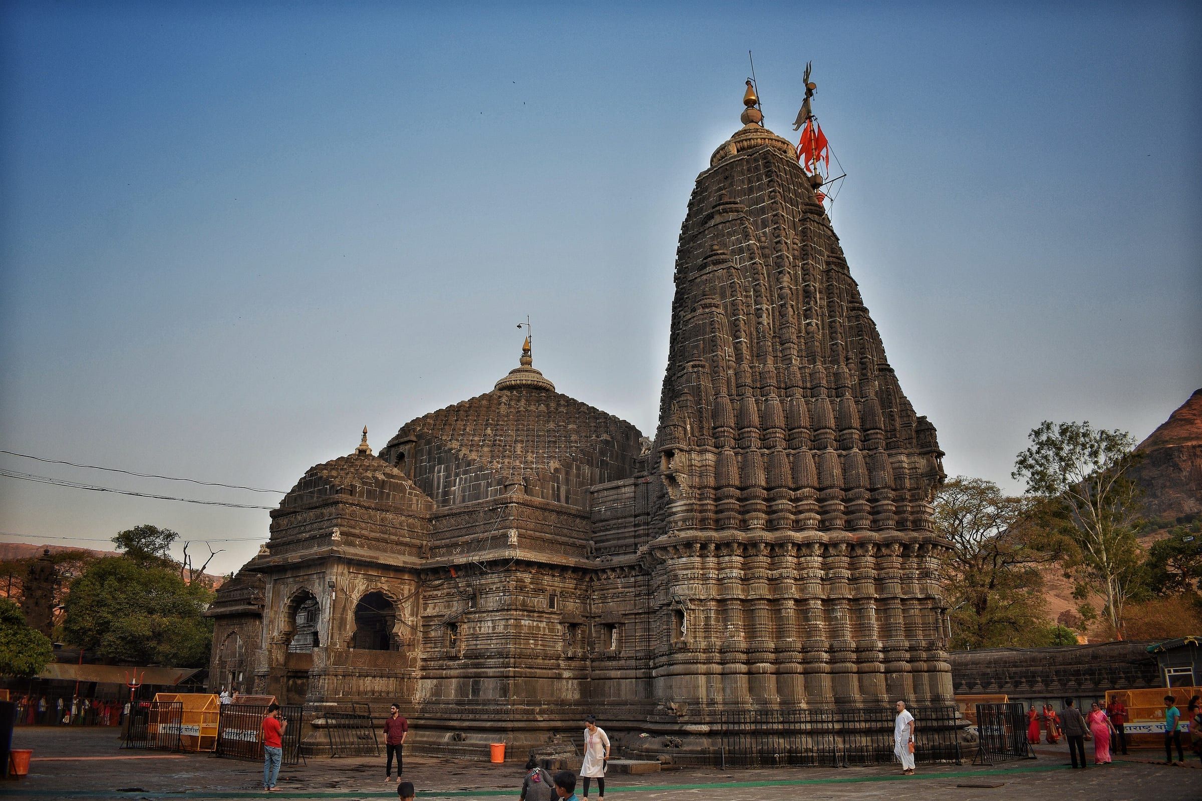 The tall black stone spire of Trimbakeshwar Temple against the sky