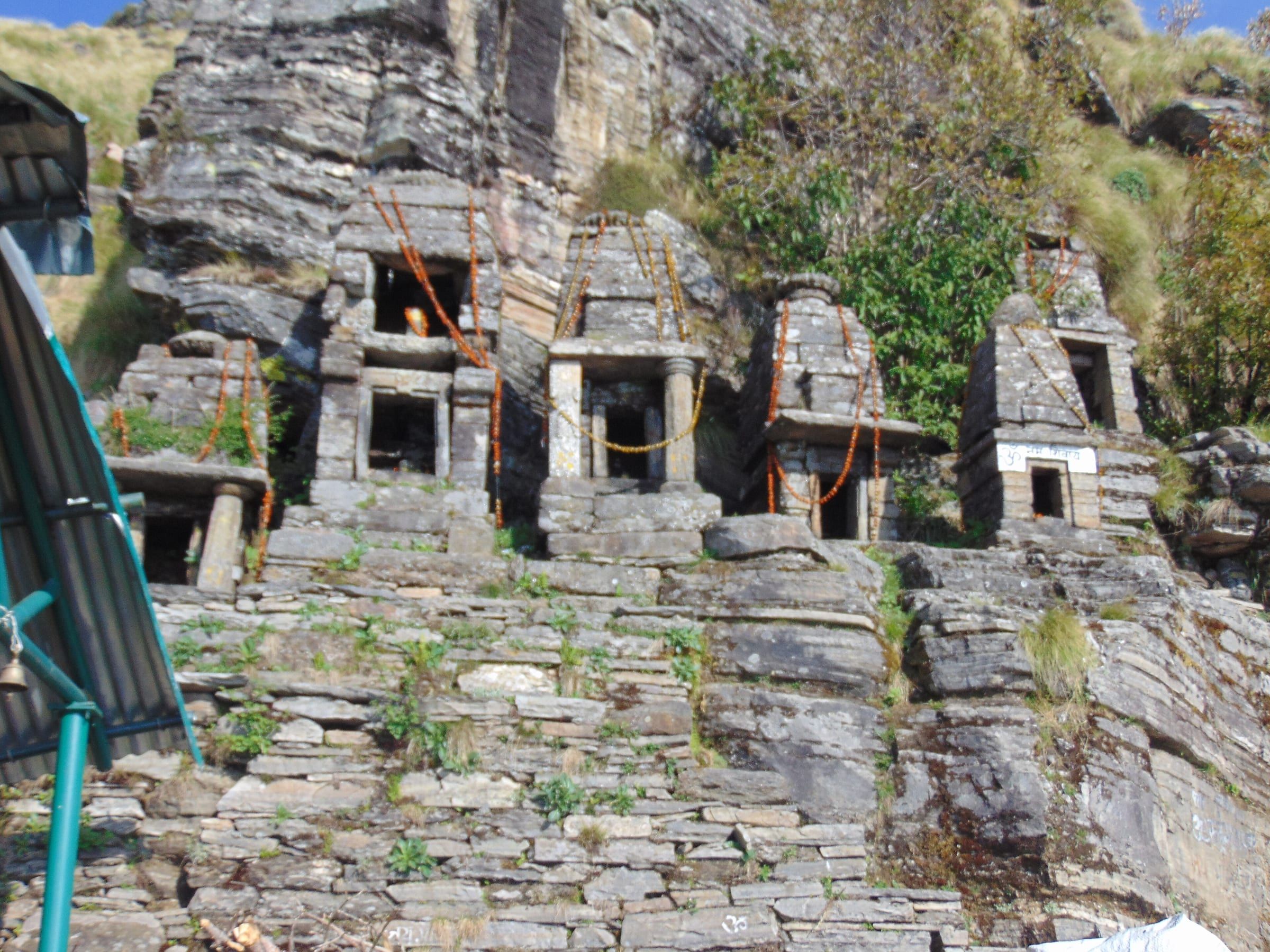 The small stone shrines at Rudranath on a green Himalayan slope