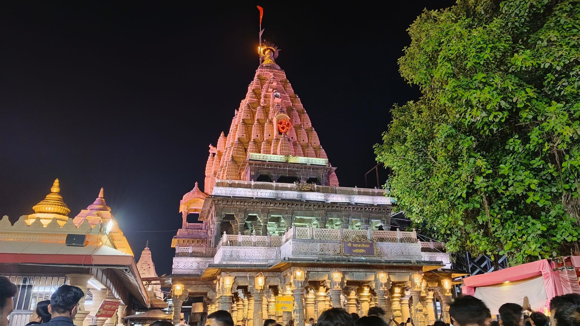 Mahakaleshwar Temple in Ujjain, its spire lit against the evening sky